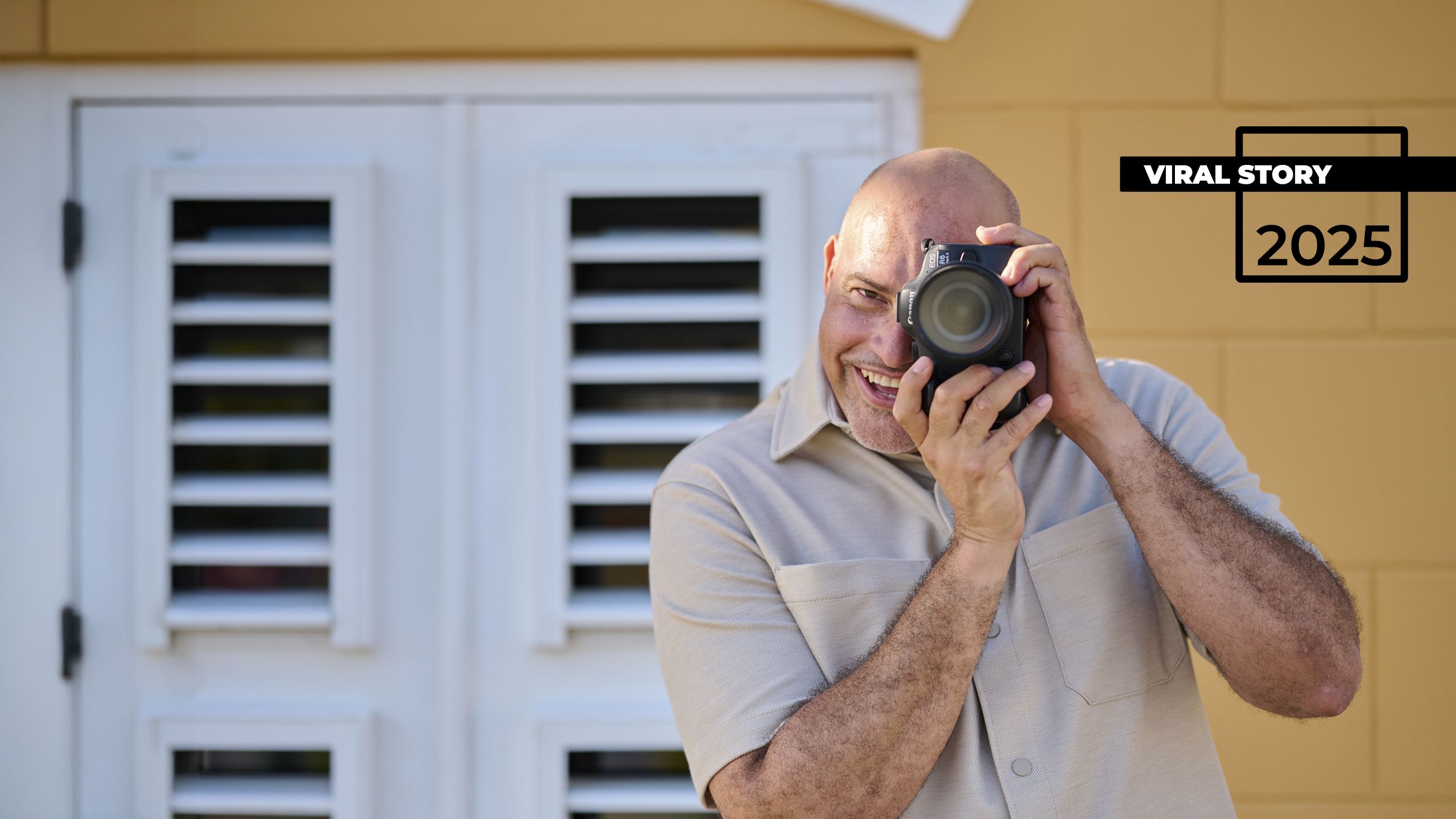 a person taking a picture with a camera on a foggy day