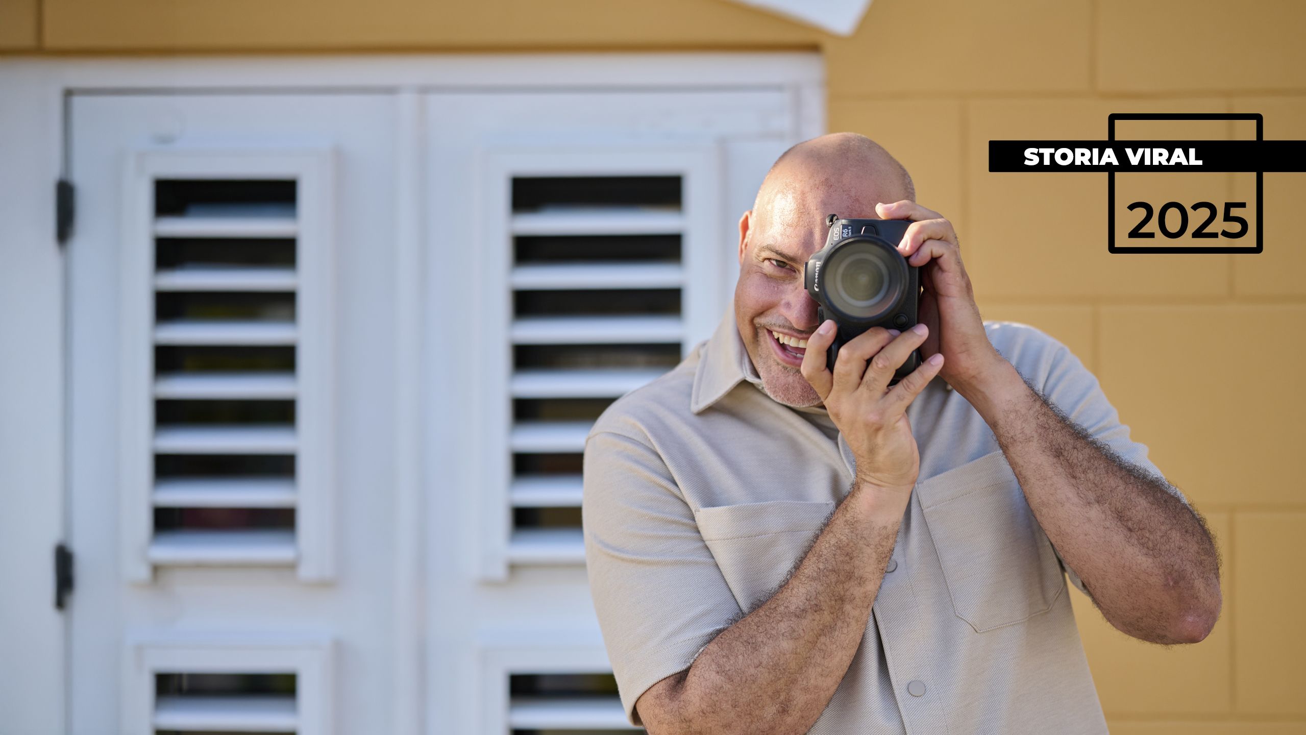 a person taking a picture with a camera on a foggy day